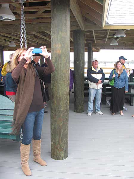 pier-dedication-4-woman-&-camera-phone