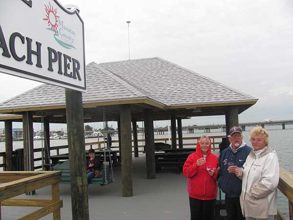 pier-dedication-9-trio-at-sign